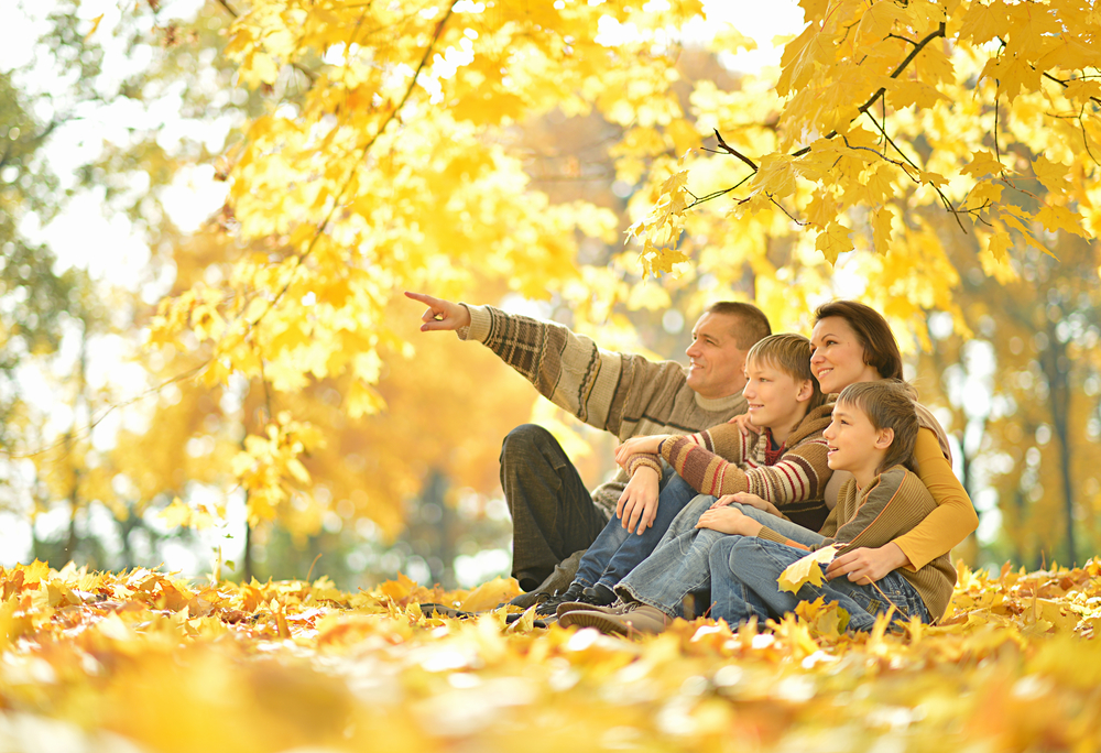 United family resting together after exercise in autumn